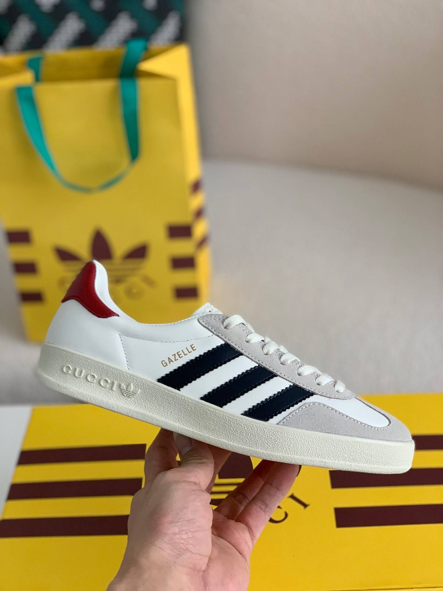 GU*I× Adidas sneakers