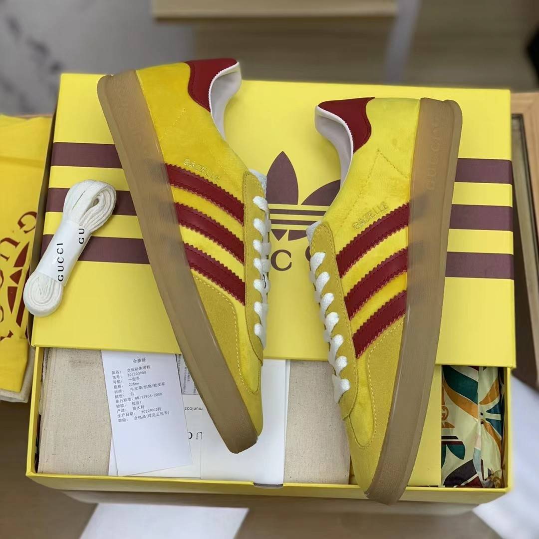 GU*I× Adidas sneakers