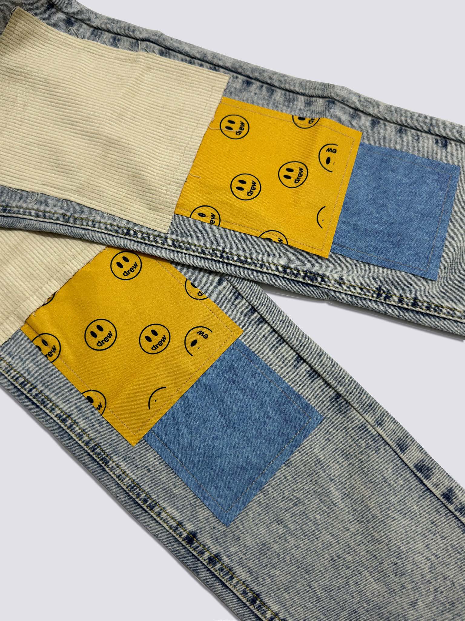 Drew House Smiley Face Digital Picture Sticker Stitching Jeans